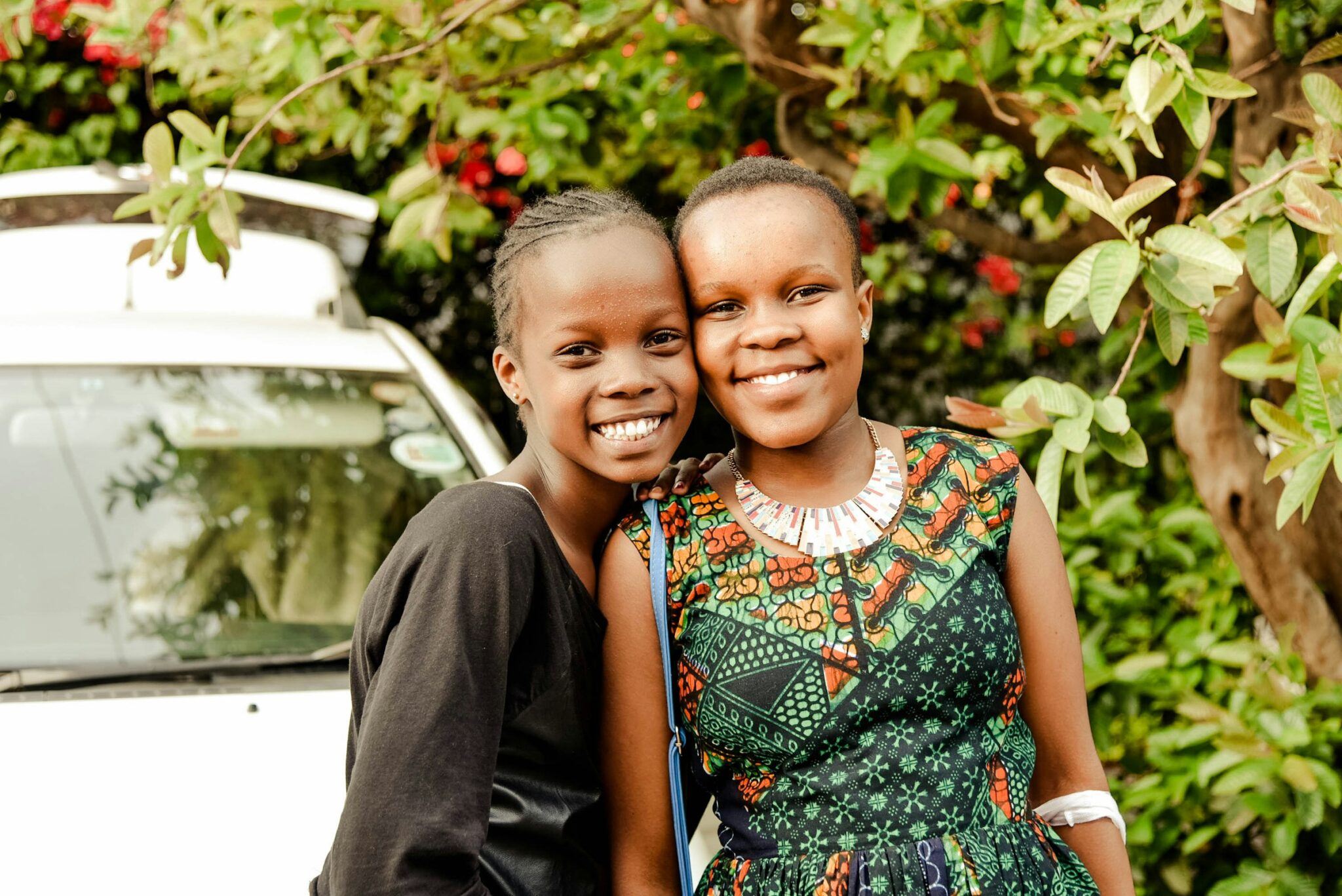 Two smiling sisters in Nairobi, Kenya