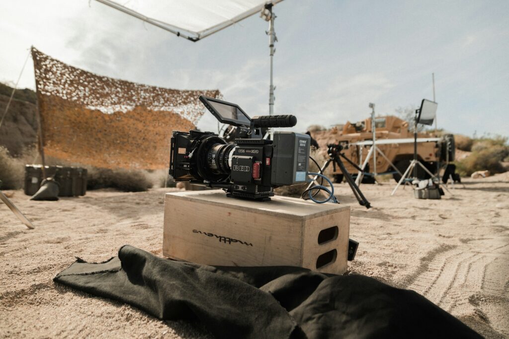 A cinema camera rigged on location in the field
