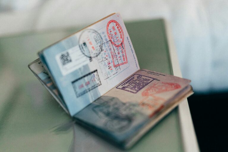 An open passport with immigration stamps
