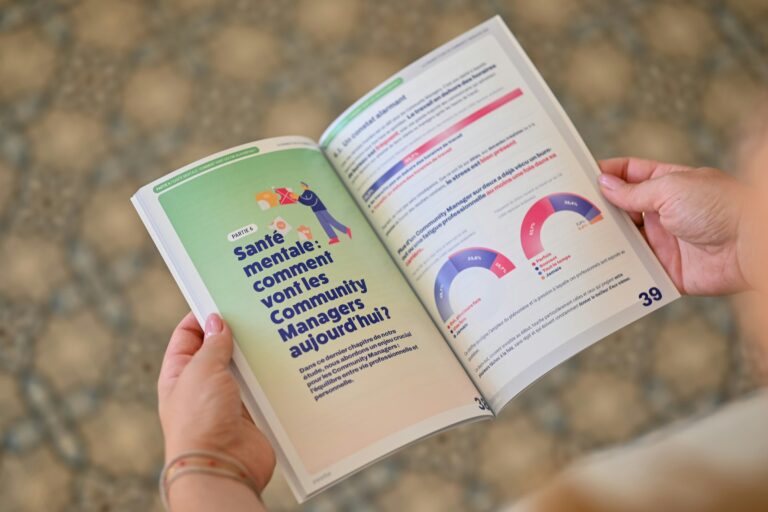 A person reading a printed report with charts